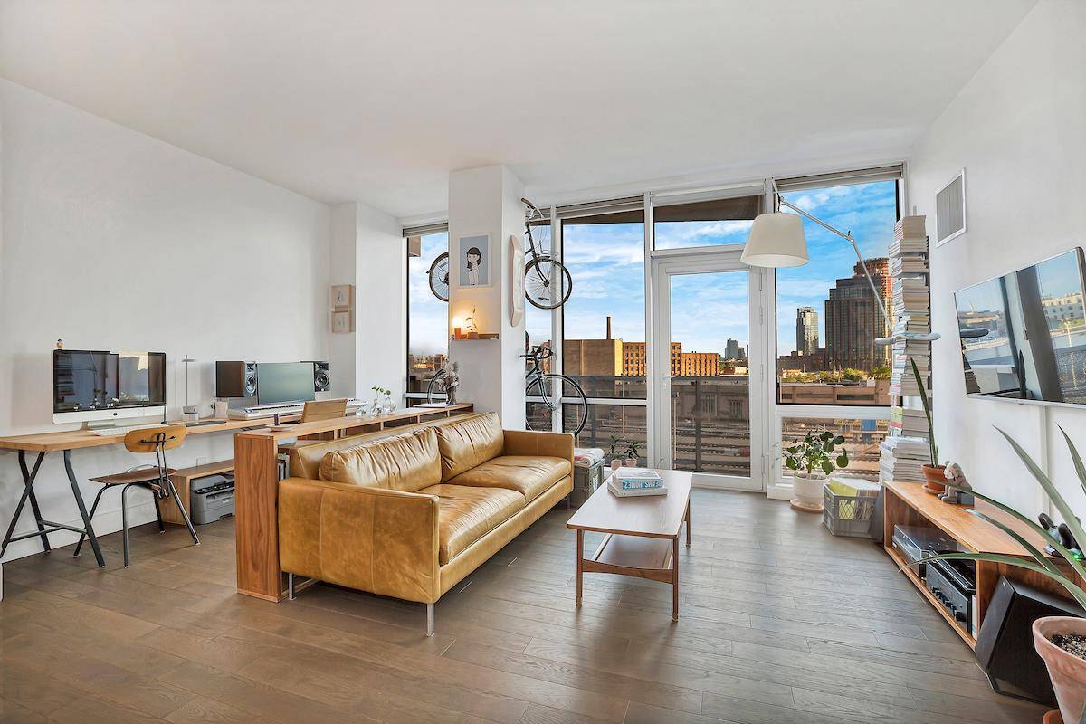 Very Mod loft like south facing 1BR unit lined with floor to ceiling windows and wide plank hardwood floors throughout.