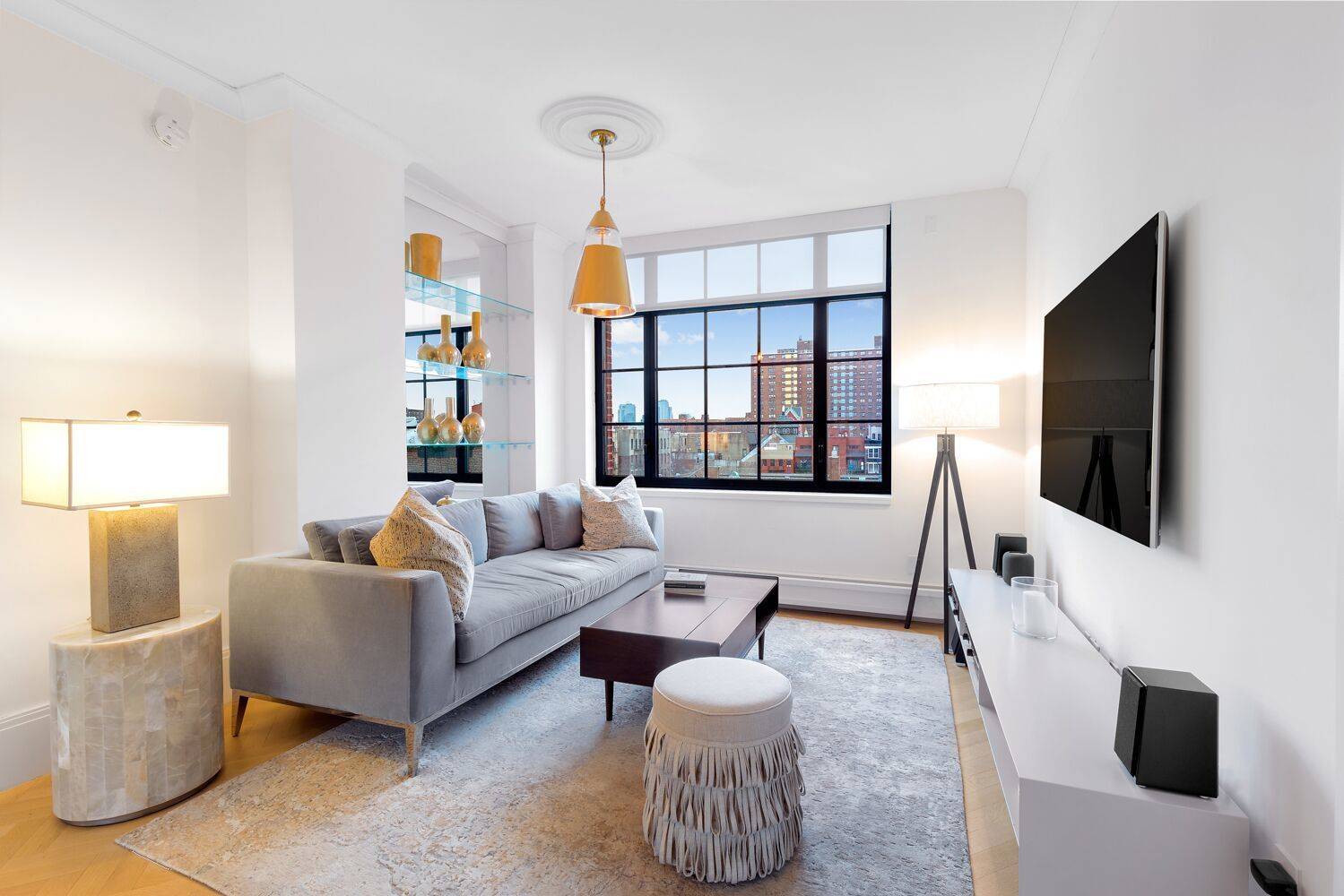 The perfect work from home set up unobstructed views of the Lower East Side, high ceilings, and generously spaced home office plus an open kitchen.