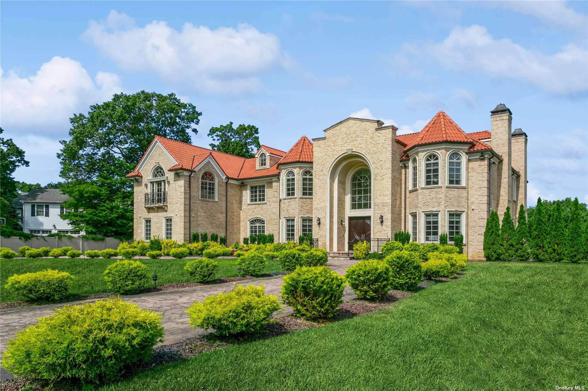 Experience the grandeur of this exquisite, newly constructed 11 bedroom contemporary colonial brick mansion.