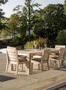View of patio featuring outdoor dining space and view of scattered trees