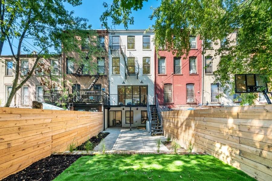 Located on a beautiful tree lined block in Bedford Stuyvesant, this legal two fam brownstone is a charmer that mixes modern sensibility with an income producing unit.