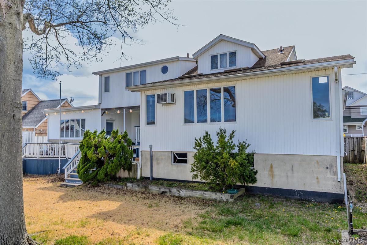 Back of Home showing large yard. Pool? Swings? There's room with proper approval.