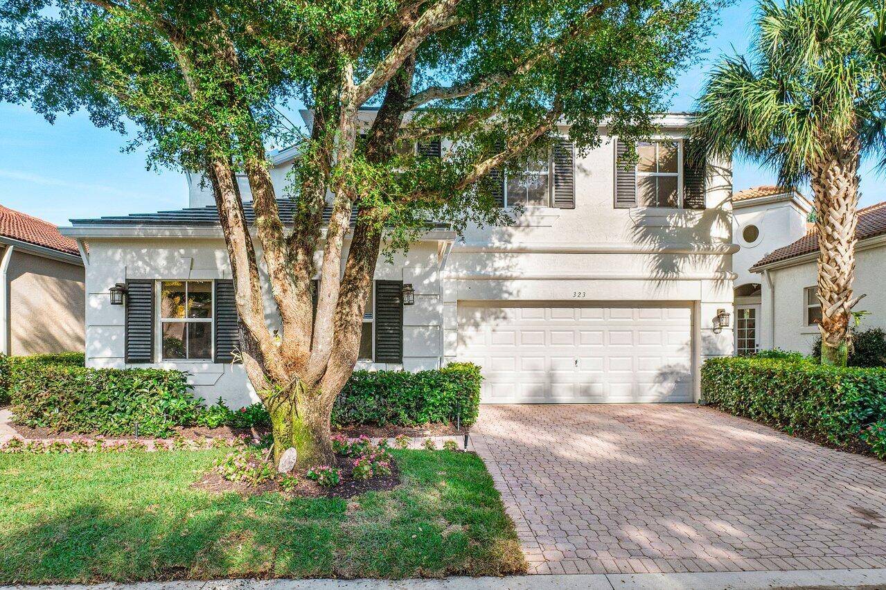 Fully renovated furnished home in exclusive Ballenisles Golf Club.