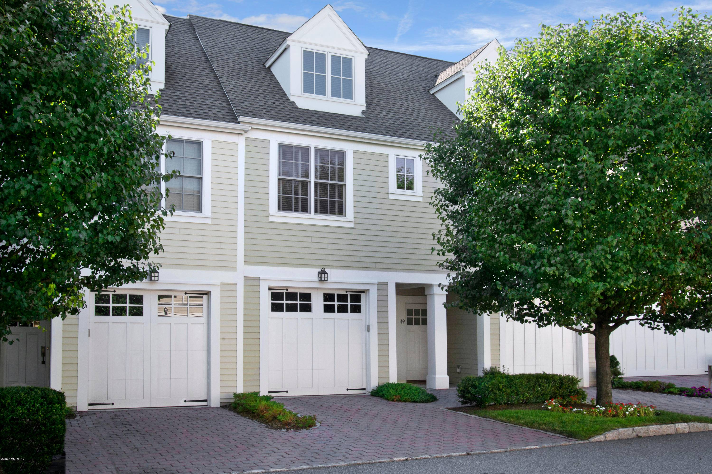 Sun filled and pristine townhouse in the private, gated Palmer Hill community located on the Old Greenwich Stamford border.
