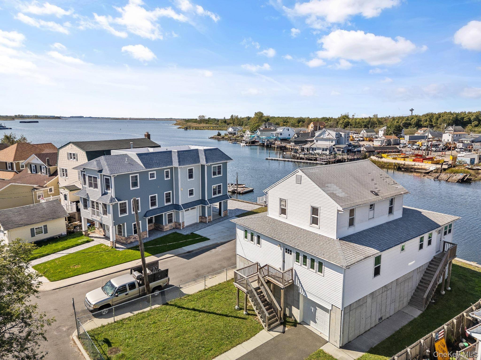 Welcome to this waterfront Colonial in the Meadowmere Park area of Lawrence.