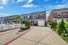 Two family brick property with an attached garage & driveway
