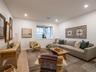 Living room featuring wood finished floors and recessed lighting