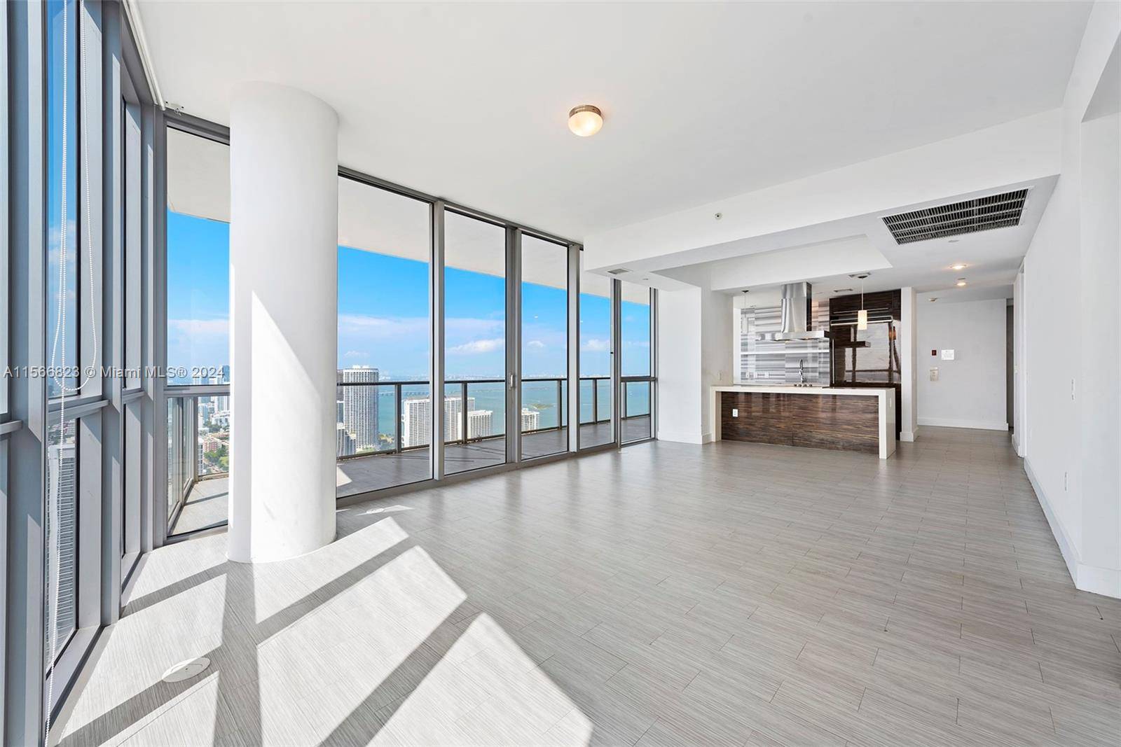 Exquisite 2 bedroom 2. 5 bath corner residence with wrap around glass walls commanding stunning views of the bay, Miami Beach, and sunsets !