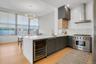 Renovated and expanded kitchen includes 6-burner Wolf range and Subzero Wine Fridge