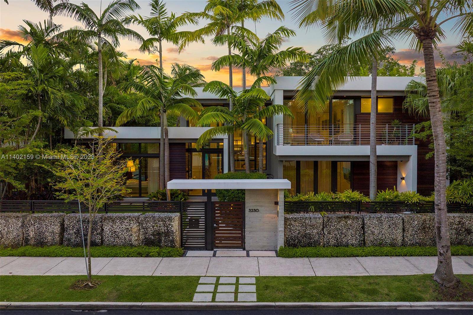 Indulge in the ultimate Coconut Grove lifestyle in this extraordinary modern estate by renowned architect Charles Treister.