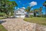 Elevated living space stayed dry during recent storms, paver driveway allows for plenty of parking and yard has room for pool and extra space for boat
