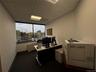 Office with a drop ceiling and heating unit