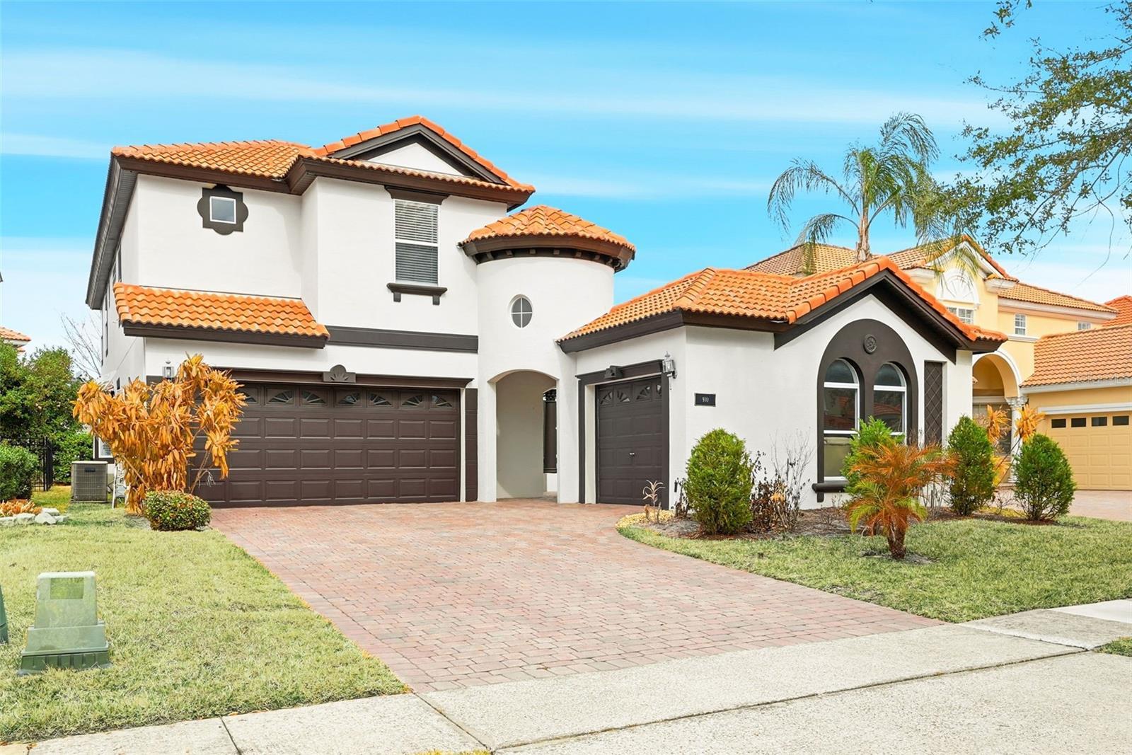 Beautiful Mediterranean style Home with 3-car garage and court yard