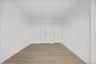 Bedroom #2 with closet and vinyl plank floors