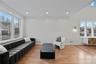 Living area featuring light wood-style floors and recessed lighting
