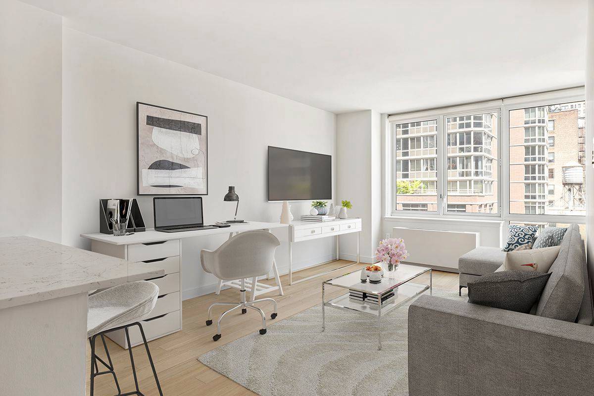 Bright one bedroom with oversized corner living room windows, open gourmet kitchen with stainless steel appliances, stone countertops, and eating bar, and an in unit washer dryer.