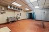 Miscellaneous room with a paneled ceiling and electric panel
