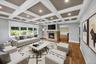 Second Living Room with beautifully decorated ceilings featuring recessed lighting, second fire-place and large windows throughout. Furniture has been