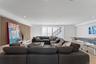 Living area featuring wood finished floors, recessed lighting, and stairway