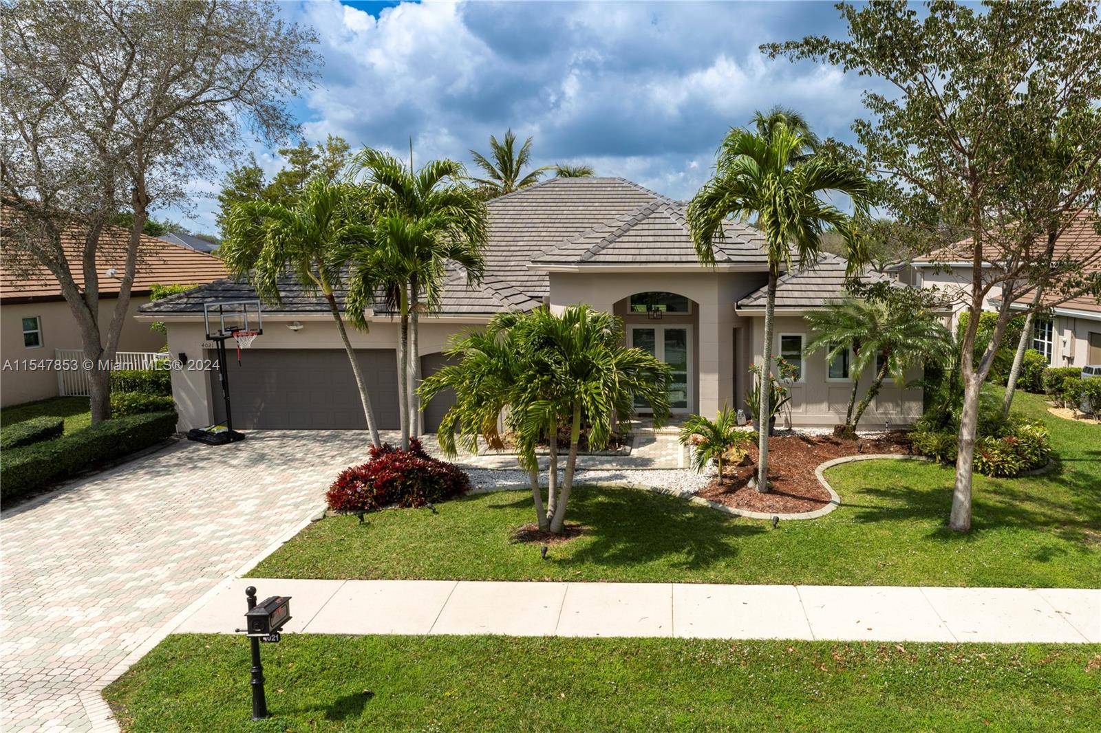 Remodeled single family home with Brand new ROOF in the heart of University Drive in Davie, FL.