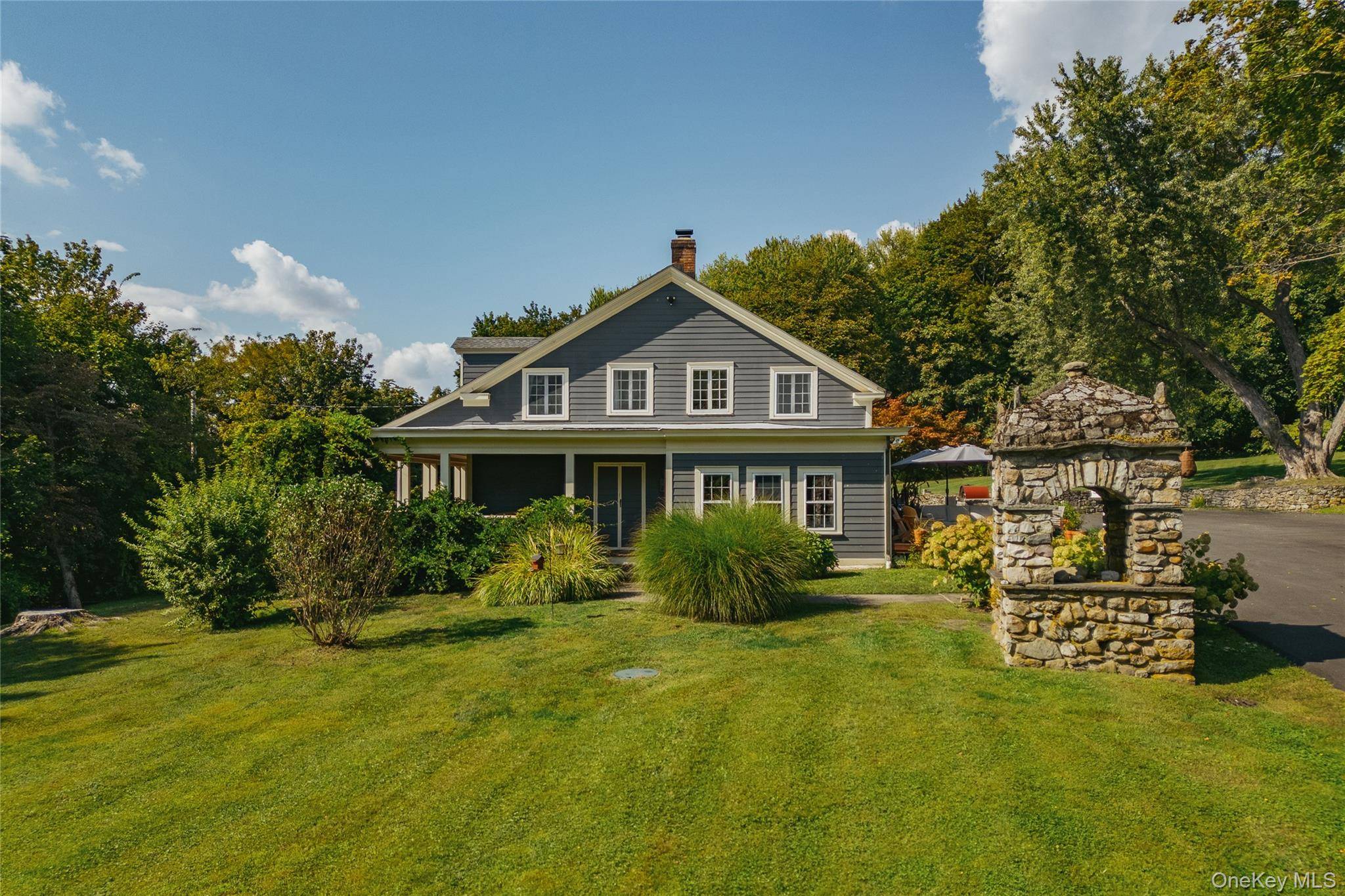 Step back in time and experience the charm of a bygone era with this stately 1835 Colonial home, once owned by retail magnate J.