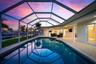 The living room and two of the bedrooms open out onto the pool deck.