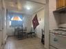 Dining room featuring light tile patterned flooring and a baseboard heating unit