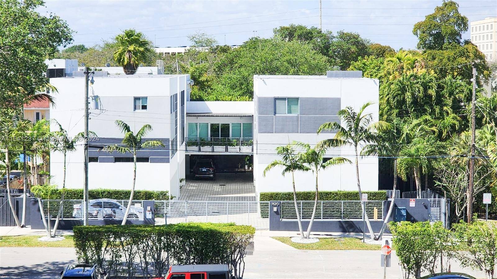 This fantastic contemporary South Miami townhouse boasts an open floor plan spread across three levels.