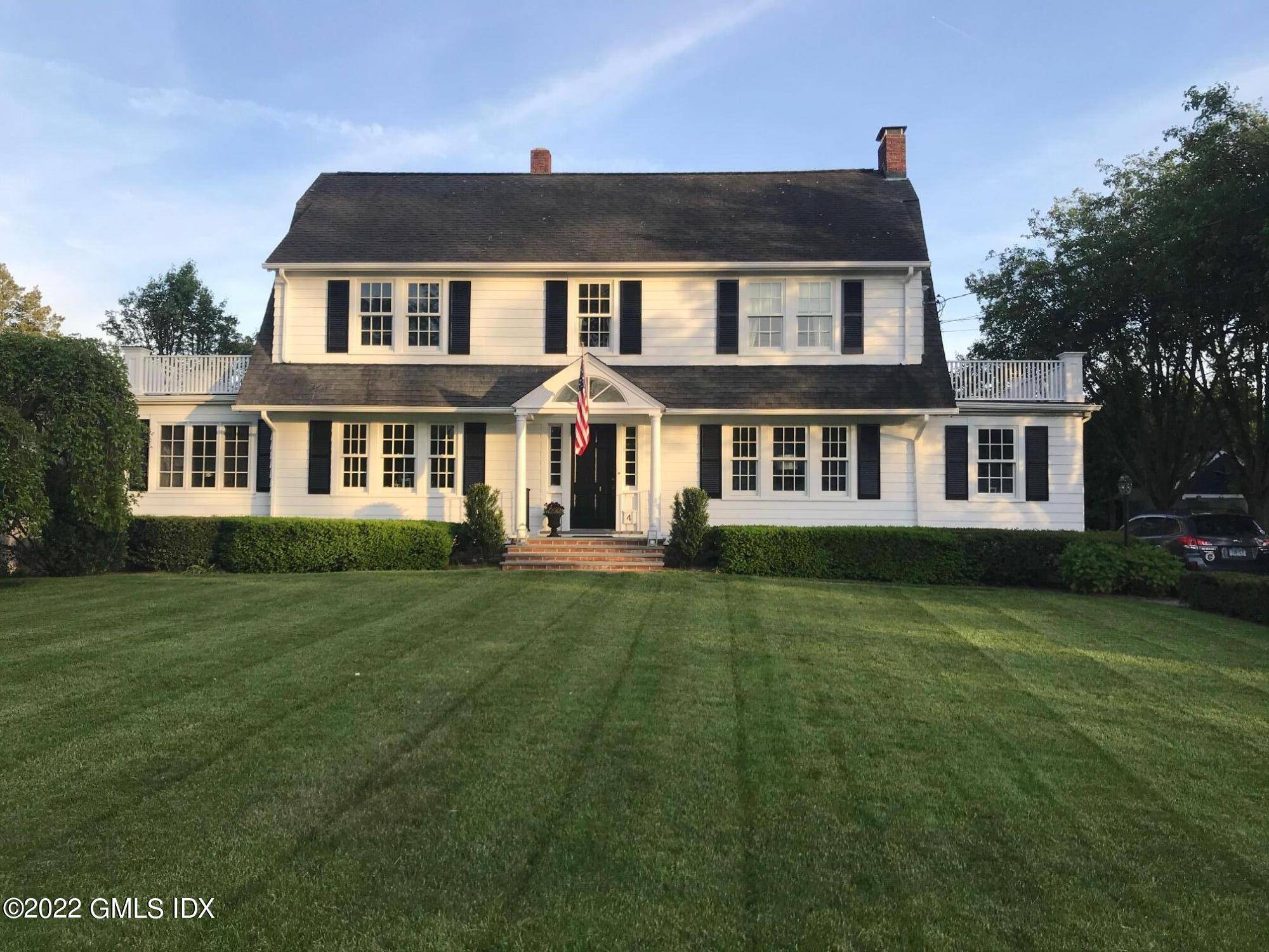 Stately Colonial in Old Greenwich south of the Village on a delightful street with access to neighborhood dock with stunning water views.