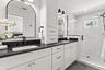 Level Two: Ultra Luxurious Primary en suite bathroom with double vanity sinks.