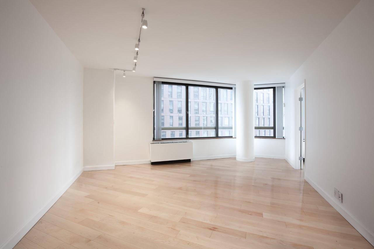 Stunning fully renovated 2 bedroom 2 bathroom with The Empire Building and East River views.