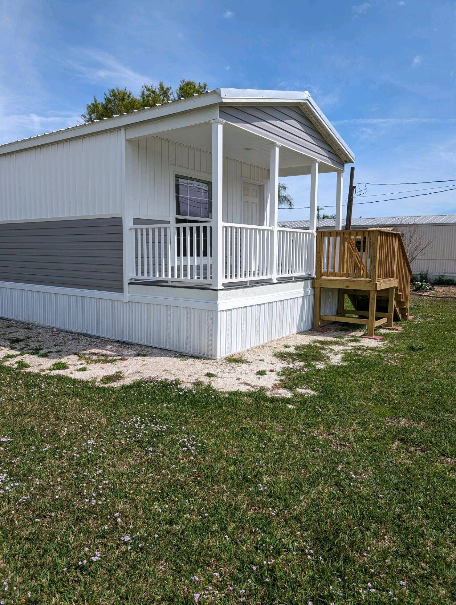 ENJOY THIS BRAND NEW 2023 SCOTBILT MOBILE HOME JUST SET UP ON A CANAL LOT IN ROSEBUD PARK.