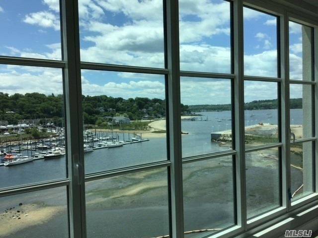 Exquisite Views Of The Water From This Corner Residence On The Top Floor Of The Beacon at Garvies Point.