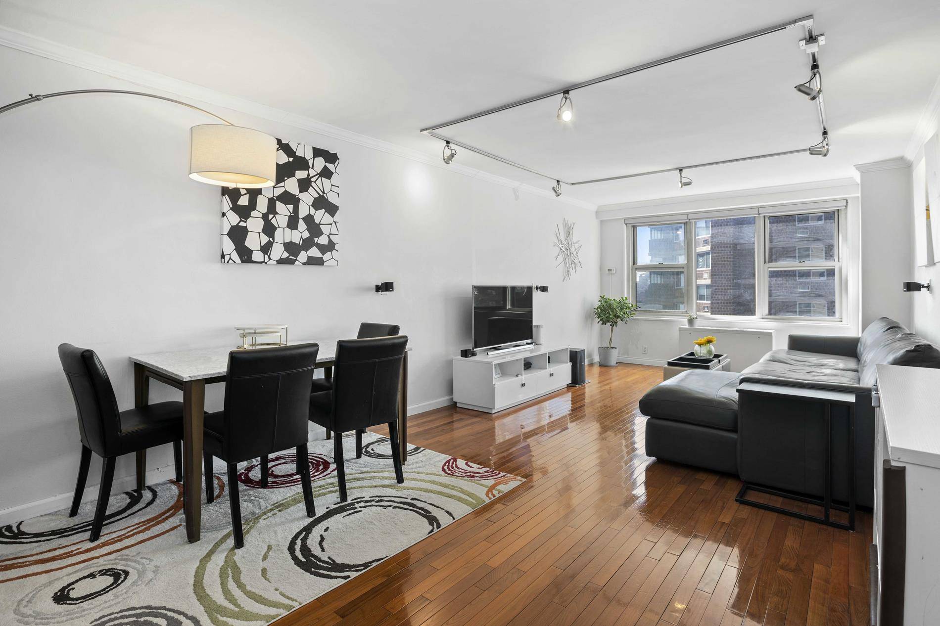 MOVE IN READY ! This one of a kind, south facing extra large one bedroom offers an abundance of sunlight and views downtown including the Freedom Tower !