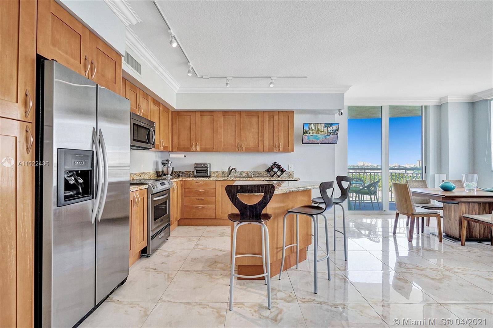 Open and bright 3 bedrooms, 2 baths corner unit at Duo with incredible views of the Diplomat Golf Course.