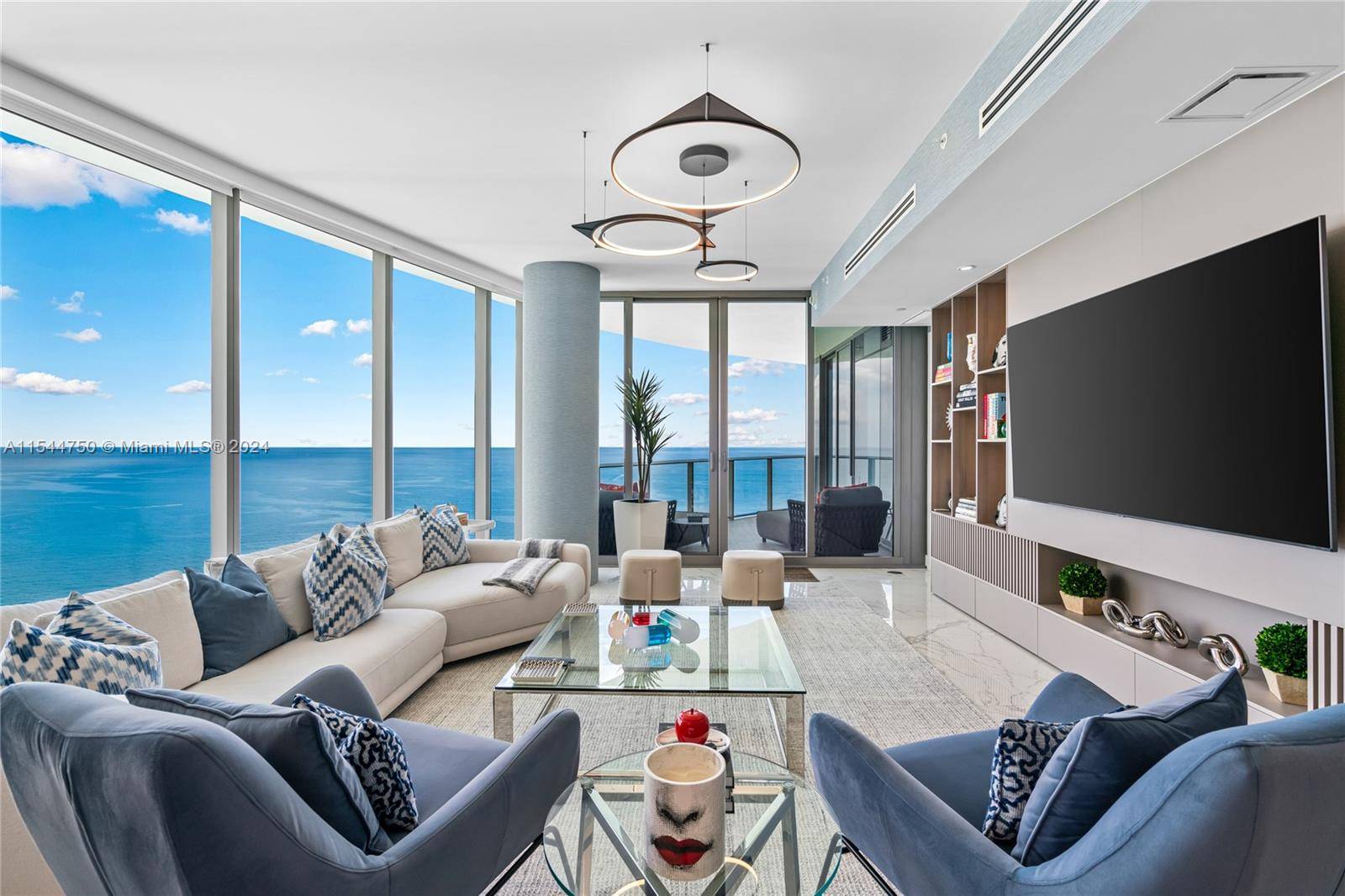 This luxurious residence at the Ritz Carlton in Sunny Isles features three generous bedrooms and four bathrooms, with the direct elevator leading to the private foyer, all complemented by stunning ...