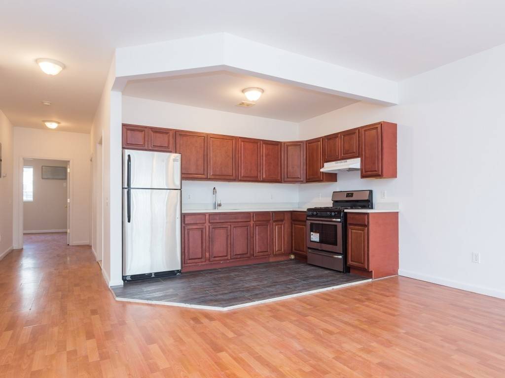Welcome home to this spacious duplex with private outdoor space in desired Stuyvesant Heights.