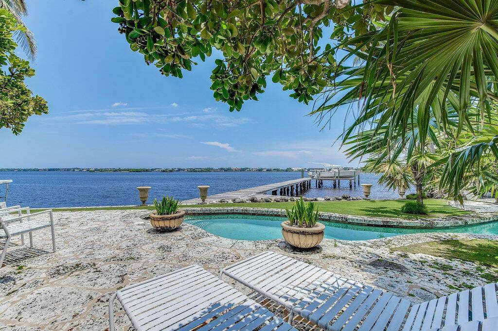 This 2, 800 sq. ft. home is a fully furnished rare find located South of Southern directly on the intracoastal waterway with expansive water views.
