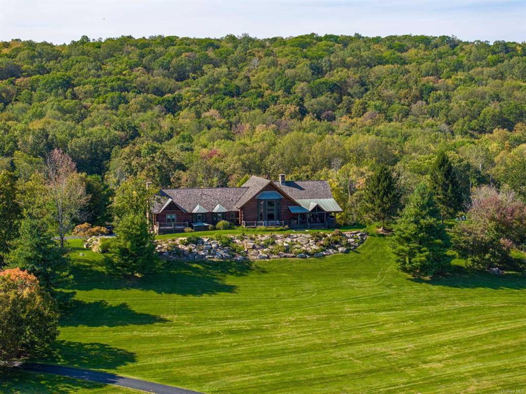 Experience modern ranch living on this stunning 227 acre parcel with rolling hills, Berkshire mountain views, and significant frontage on a pristine 46 acre pond.