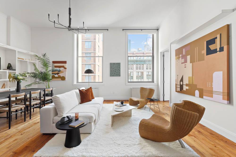 Measuring over 1, 000 square feet with 13 ft ceilings, this mint condition loft at The O Neill Condominium features incredible natural light, thoughtful modern design, and Empire State Building ...