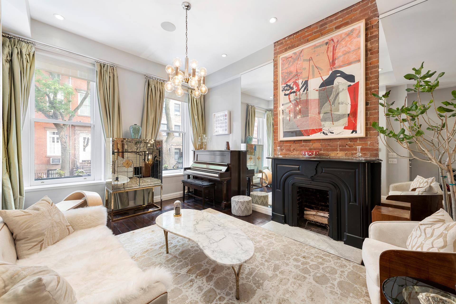 Enter into the parlor level of this spacious 3, 187 square foot, three bedroom triplex condominium in the heart of Greenwich Village.
