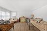 Bright open and airy living room with new luxury vinyl flooring and freshly painted.