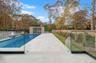 View of pool with a fenced backyard and a patio