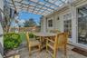 View of patio with pergola and outdoor dining