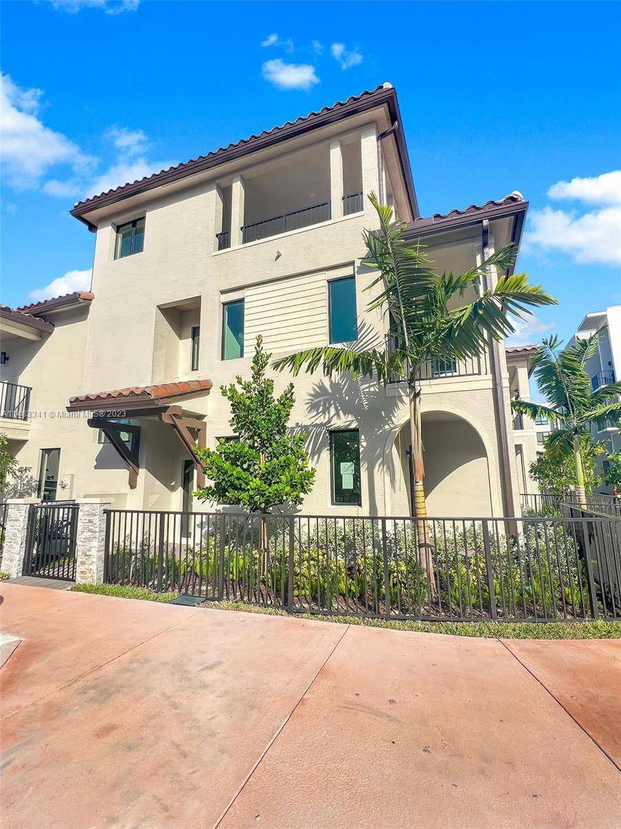 Modern and Beautiful 4 story Corner townhome Resort style, located in the desirable Downtown Doral, with sky view !