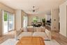 Living room with visible vents, light wood finished floors, baseboards, and plenty of natural light