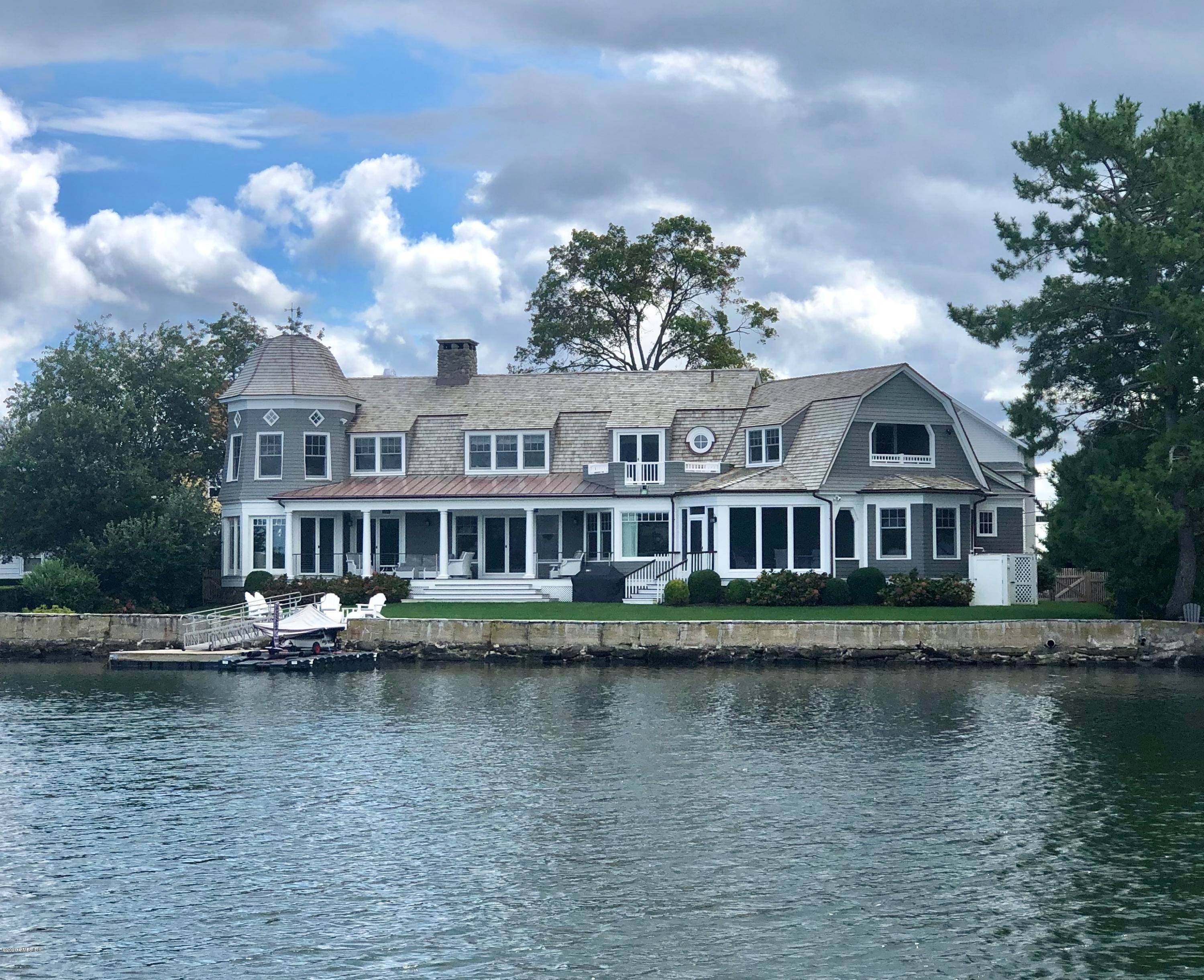 Lucas Point beautifully waterfront home renovated inside and out to the highest standard.