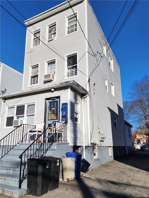 Nice two family home in New Rochelle with small enclosed porch, 1 bedroom, 1 bath and 1 half bath on 1st floor unit.
