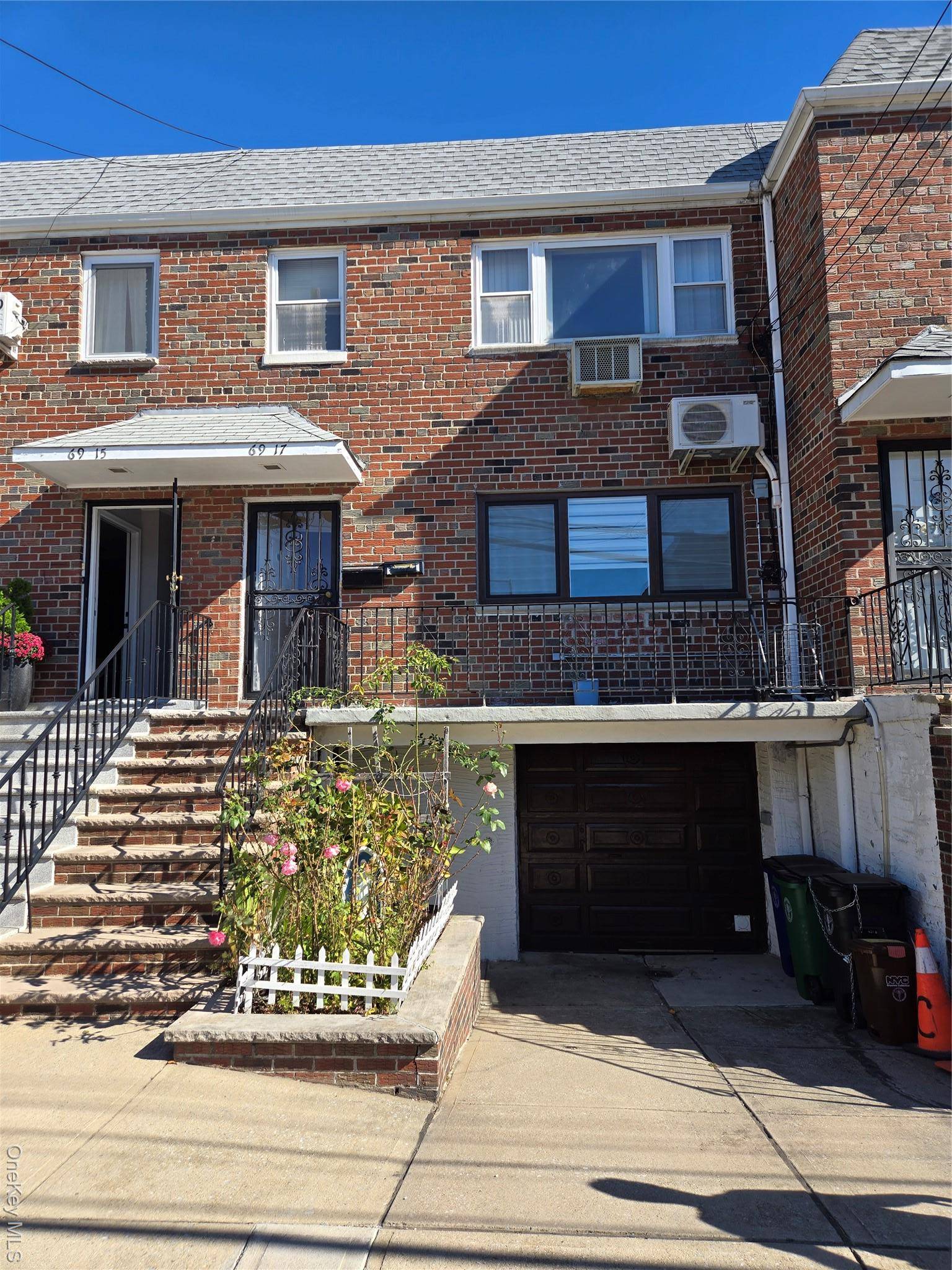 Brick 2 Family Home with private driveway Garage Front porch Roof well maintained.