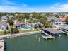 Seawall New in 2026. Private Dock w/ 20,000 covered boat lift, jet ski lift and 10x18 deck over the water